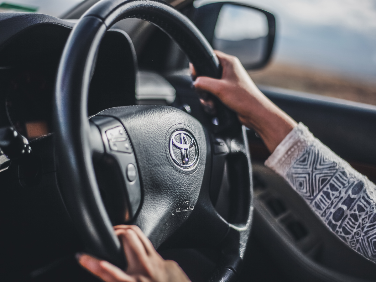 Woman driving a Toyota car